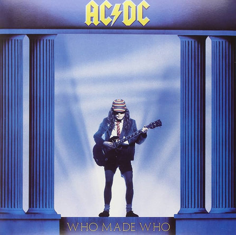 Album cover of AC/DC's 'Who Made Who' with a Angus young holding a guitar in front of classical columns.
