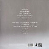Album tracklist on a gray background with Wonderlick logo.