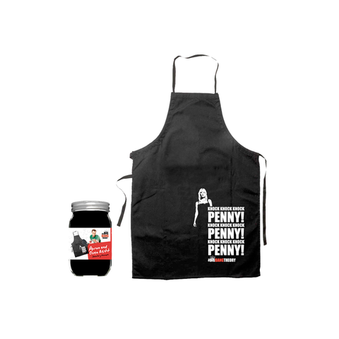 A black apron with a white graphic print of a woman and the text 'I'M SPOONING BLACK PENNY!' is shown next to a glass jar of 'Spooned to the Left' jam on a plain white background.