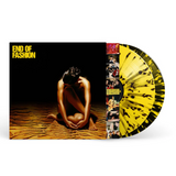 Vinyl record with a cover featuring a person sitting on sand and 'End of Fashion' text with splattered vinyl showing
