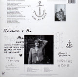 Album cover with text and black and white photo of a person, featuring the band Florence + The Machine.