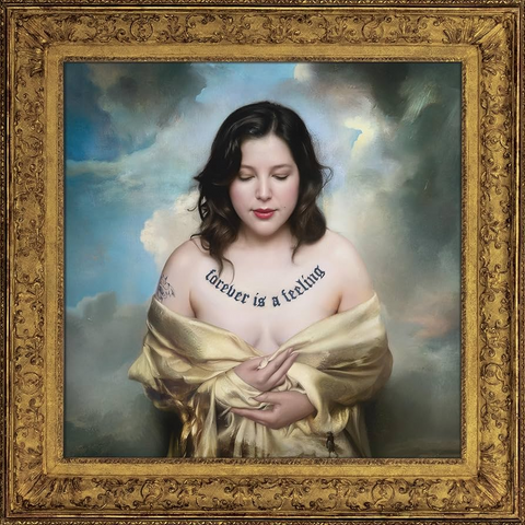 Dacus wrapped in a shawl with 'forever is a feeling' text, framed by ornate gold border