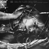 Black and white album cover with Paloma Faith behind shattered glass