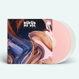 Vinyl record with colorful cover featuring 'Röufüs du Sol' on a white background with a white and pink vinyl
