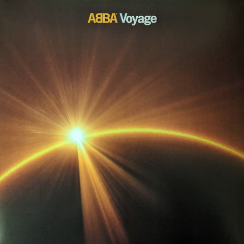 ABBA Voyage album cover featuring a solar eclipse style design against a dark background