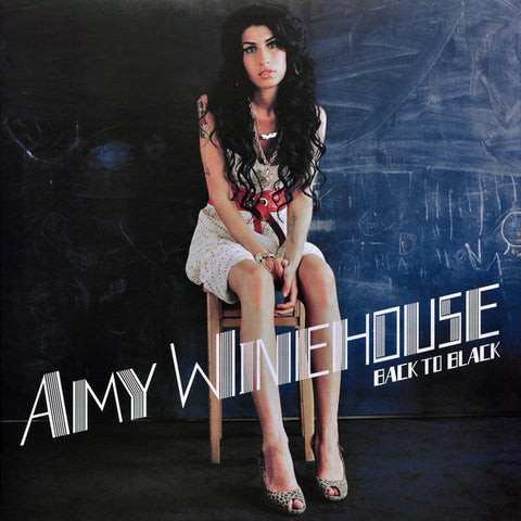 Amy Winehouse Back To Black Front Cover with Amy Sitting a stool in front of a chalk board