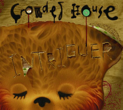 An album cover featuring a stylized illustration of a bear's face with the text 'CROWDED HOUSE' and 'INTRIGUER'.