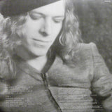 A close up portrait of Bowie in black and white with track listing