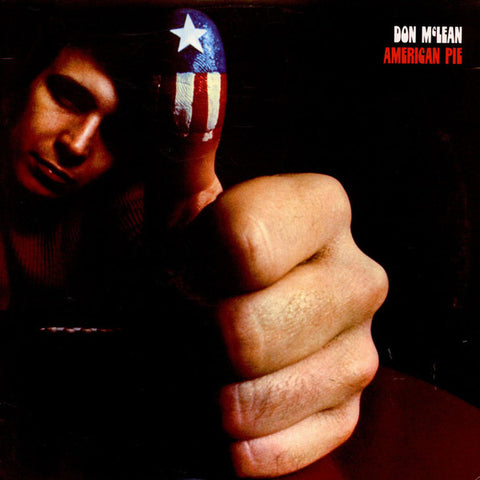 The image displays the cover of Don McLean's album 'American Pie.' It features a close-up of a hand making a fist, with a close-up of a person's face in the background, partially obscured by the hand.