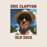 Eric Clapton Old Sock album cover featuring portrait of Clapton against a palm tree backdrop