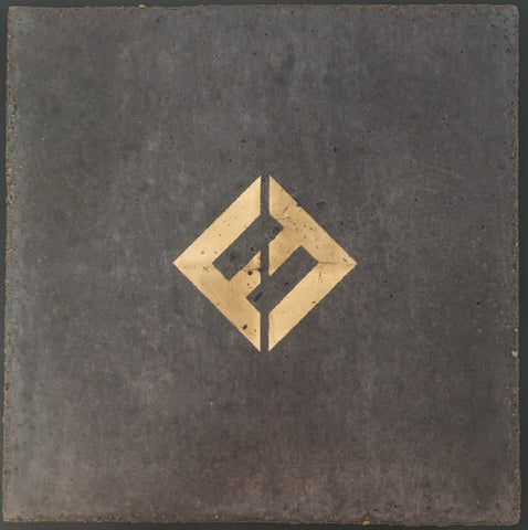 A muted gray background with a prominent, stylized "F" logo in a golden hue positioned centrally within a diamond shape.