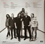 ‘The Essential Foo Fighters' Back cover black and white photo of the Foo Fighters band members and track listing