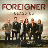 The image shows the cover of the 'FOREIGNER - CLASSICS' album, featuring a group of musicians from the rock band Foreigner, in a gatefold vinyl format.