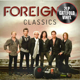 The image shows the cover of the 'FOREIGNER - CLASSICS' album, featuring a group of musicians from the rock band Foreigner, in a gatefold vinyl format.