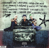 Back Cover with track listing and Green Day members wearing masks of themselves