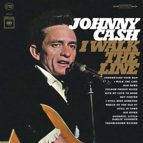 This image features the album cover for "Johnny Cash - I Walk the Line." The cover art displays a classic photograph of Johnny Cash, capturing his iconic look with a serious expression as he performs.