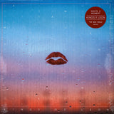 Lipstick marks against a steel backdrop of transitioning colours blue to red