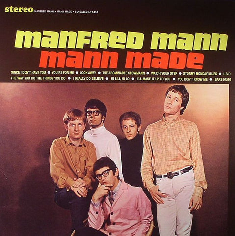 Cover of the 'Mann Made' album by Manfred Mann, featuring a group of men in various poses, with the band's name and album title text in bold.