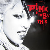 This product image features the cover art for P!NK's album "Try This." The artwork utilises a striking black and white photograph of P!NK, emphasising bold contrasts and dramatic angles.