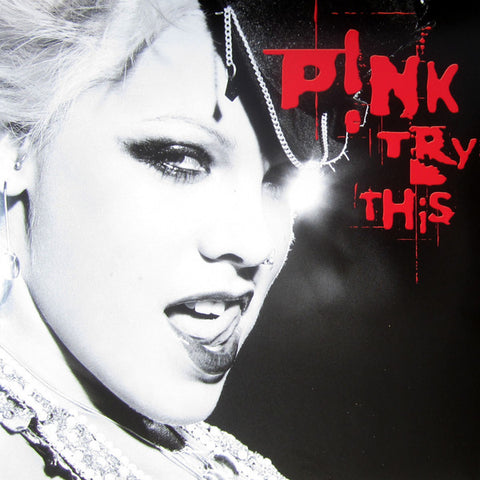 This product image features the cover art for P!NK's album "Try This." The artwork utilises a striking black and white photograph of P!NK, emphasising bold contrasts and dramatic angles.