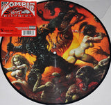 ROB ZOMBIE album 'VENOMOUS RAT REGENERATION' artwork, featuring a picture disc with a vibrant, heavy metal themed illustration including a character resembling Rob Zombie, a rat, and other fantastical elements in a red and black color scheme.