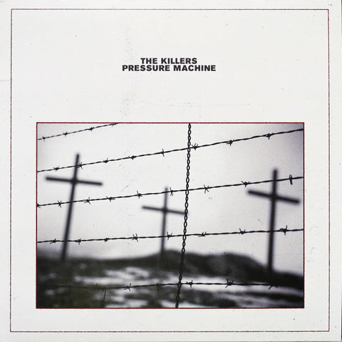 Album cover of 'The Killers - Pressure Machine' featuring a black and white photograph with barbed wire and crosses