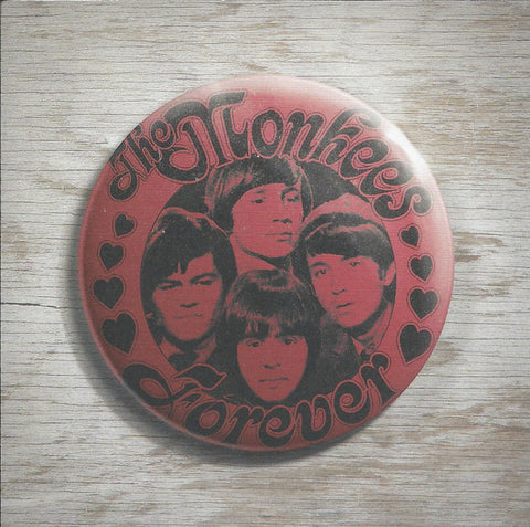 A button with 'The Monkees Forever' text and images of the band members' faces.