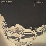 Album cover art for Weezer's 'Pinkerton' featuring a stylized illustration of a snowy landscape with houses and a figure walking.